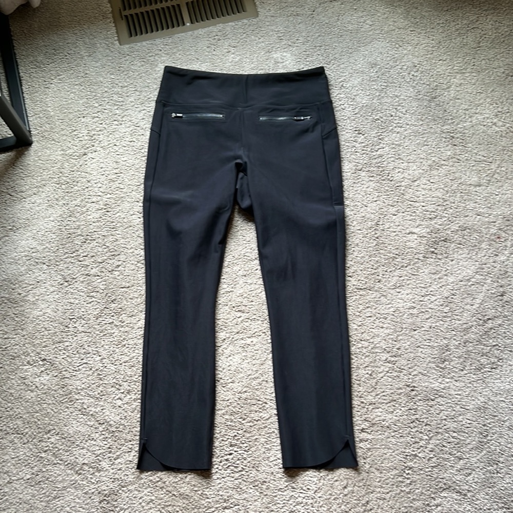 Athleta black ankle length pant with cute zip details on front